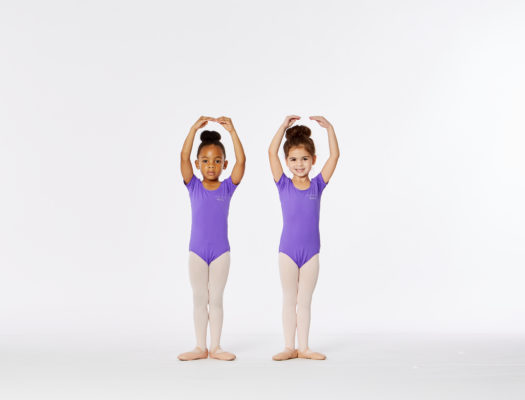 Pair of Young Ballet Students in Purple Leotards